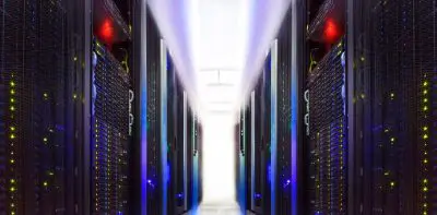 A long hallway of servers in a room.